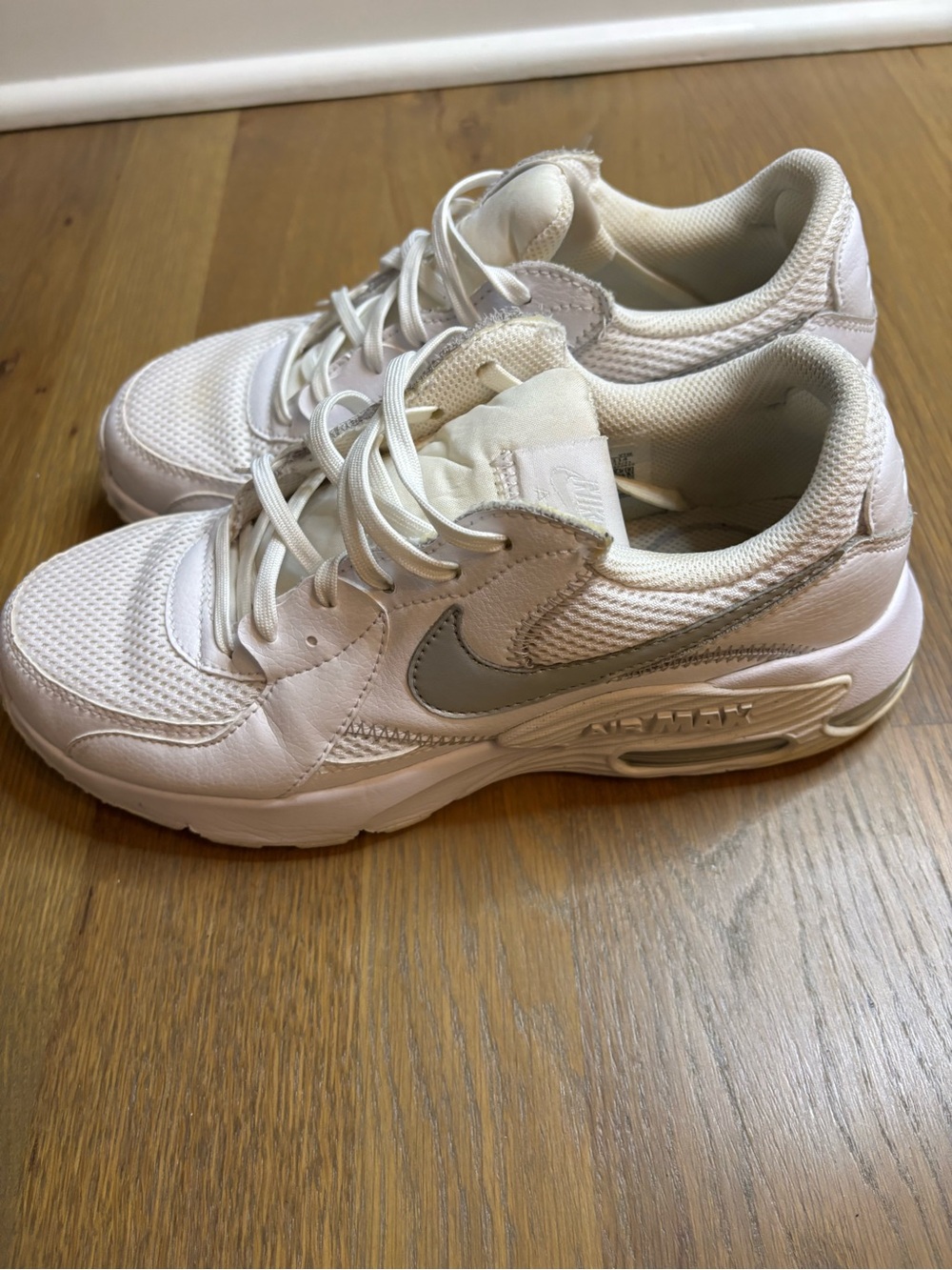 Nike White Sneakers with Silver Swoosh Accent